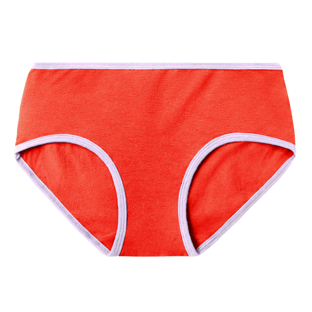 Poppy mid rise brief is a bright red tone with lilac, light purple contrast at the waist and leg openings. Has subtle hemp texture.