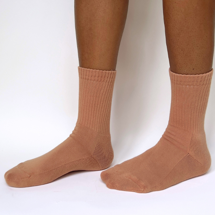 model wearing maya caramel organic pima cotton crew socks. made in peru.