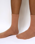 model wearing maya caramel organic pima cotton crew socks. made in peru.