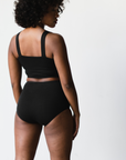 high rise black briefs in back, back view on model