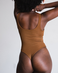 model showing back view of bodysuit