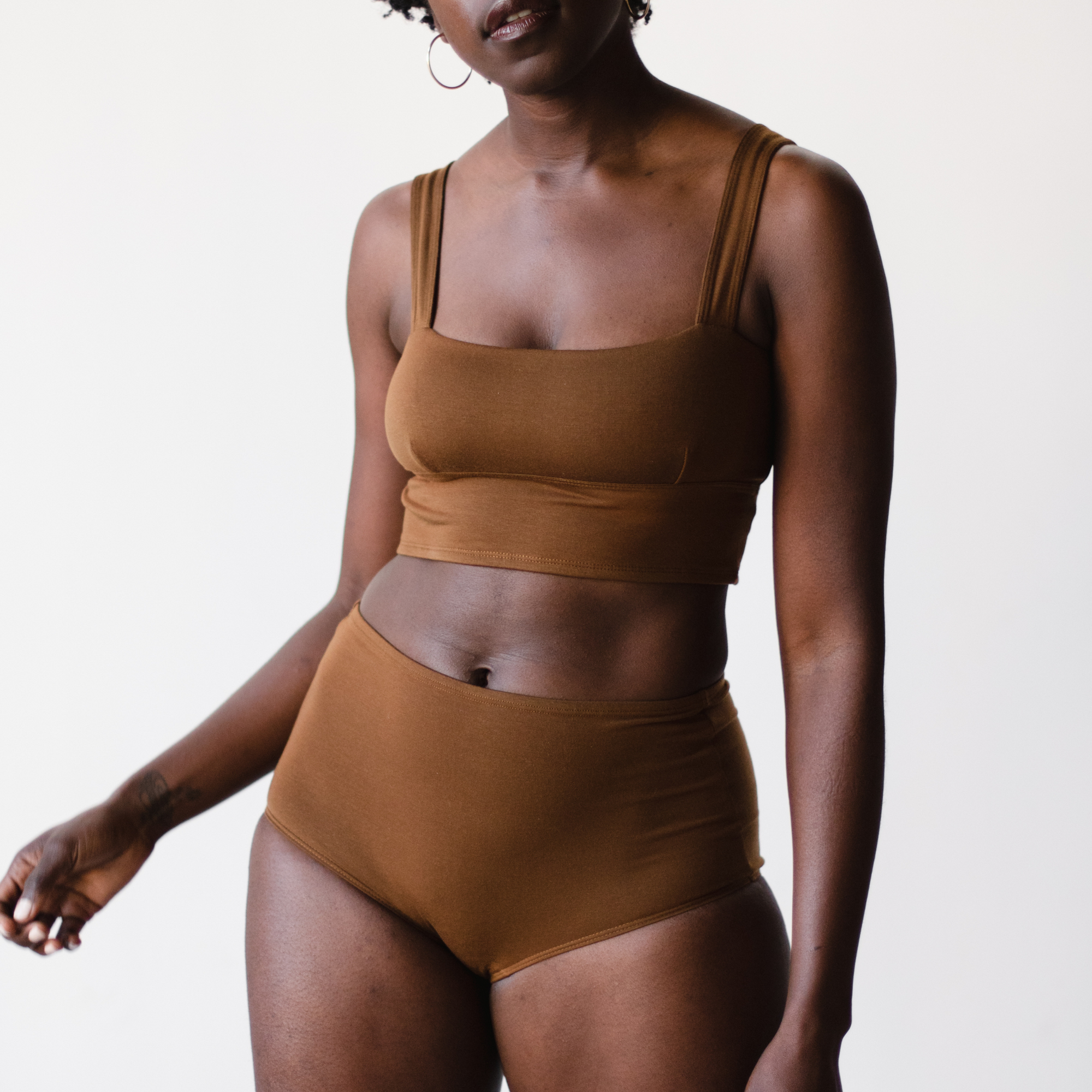 high rise ella nude, a rich brown tone,  briefs in tencel, front view on model. 