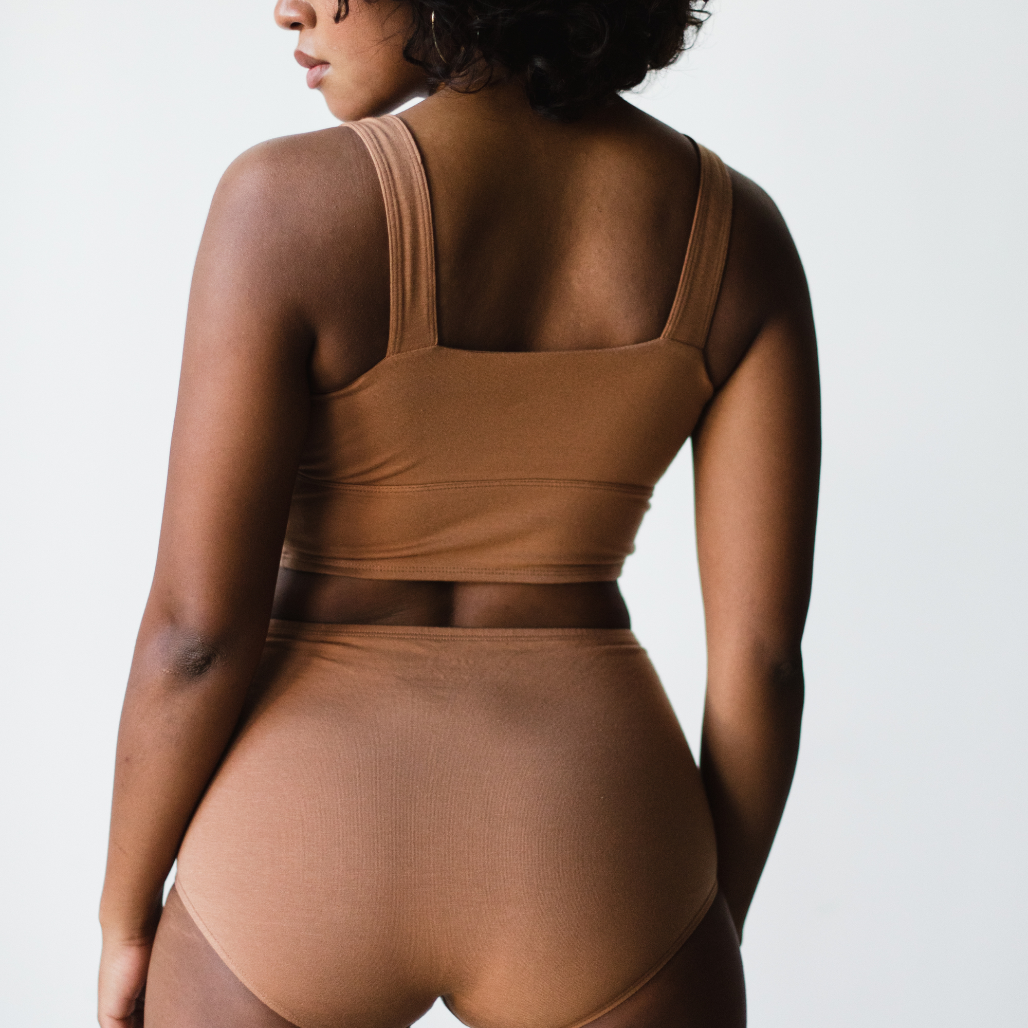 maya nude, a medium nude caramel tone, back view. made of soft and sustainable tencel.